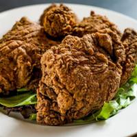 Southern Fried Chicken · Half chicken coated with our unique recipe including garlic, cinnamon, nutmeg, and clove.