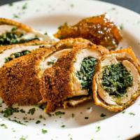 Goat Cheese & Fig Jam Chicken · Boneless chicken breast rolled around goat cheese and spinach, breaded and garnished with fi...