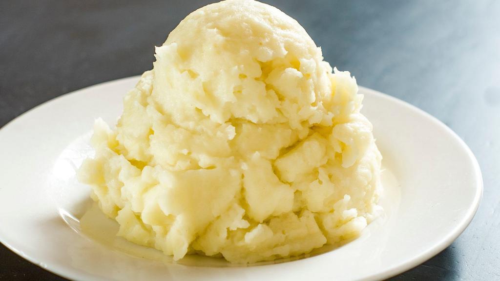 Mashed Potatoes · Side portion of mashed potatoes.