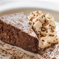 Chocolate Hazelnut Cake · Flourless cake with chopped hazelnuts and whipped cream.