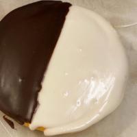Black & White · Cake like cookie iced half in chocolate, half in vanilla frosting.
