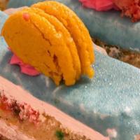 Funfetti Cake Slice · Funfetti Sponge filled with Vanilla Mousse. Topped with a French Macaroon