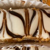 Napoleon · Flacky Crust Filled with Vanilla Custard. Tipped with Vanilla Icing