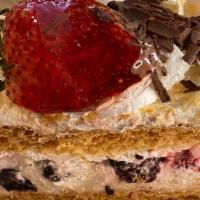 Berry Berry Napoleon · Flaky napoleon shell layered with cream and fresh berries.