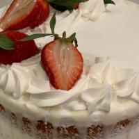 Straw Short Cake · Yellow cake with whipped cream and fresh strawberries.