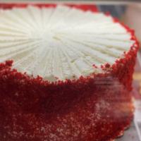 Red Velvet Cheesecake · Cheesecake base topped with red velvet cheesecake.
