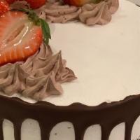 Half Molly · Chocolate cake filled with whipped cream and fresh strawberries.