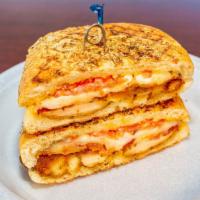 P6 - The Cougar · Breaded Chicken Cutlet with Melted Mozzarella , Bacon, Tomato, and pesto mayo on a Garlic Pa...