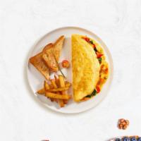 Grill The Chick Omelette · Eggs with grilled chicken, spinach, mixed peppers cooked as an omelette, served with home fr...
