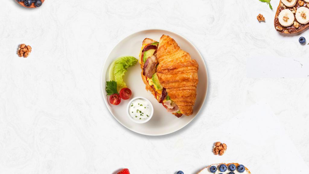 Meaty Egg Croissant · Your choice of meat with scrambled egg and cheese served on buttery croissant.