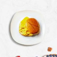 Cheesy Egg Sandwich · Scrambled egg, and cheddar cheese served on a roll.