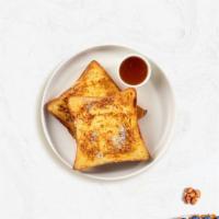 Classic French Toast · Fresh bread battered in egg, milk, and cinnamon cooked until spongy and golden brown. Topped...