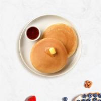 Classic Pancakes · Fluffy pancakes cooked with care and love served with butter and maple syrup. Served in pairs.