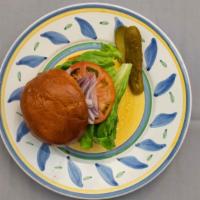 Regular Burger · Eight oz. char-grilled burger with lettuce, tomato, onion and pickle.