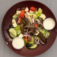 Greek Salad · Iceberg lettuce, tomatoes, feta, anchovies, mixed olives, red onions, house  cucumber and st...