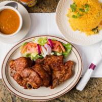 Fried Pork Chops · Served with rice and beans, sweet, green plantains, French fries, or vegetables.