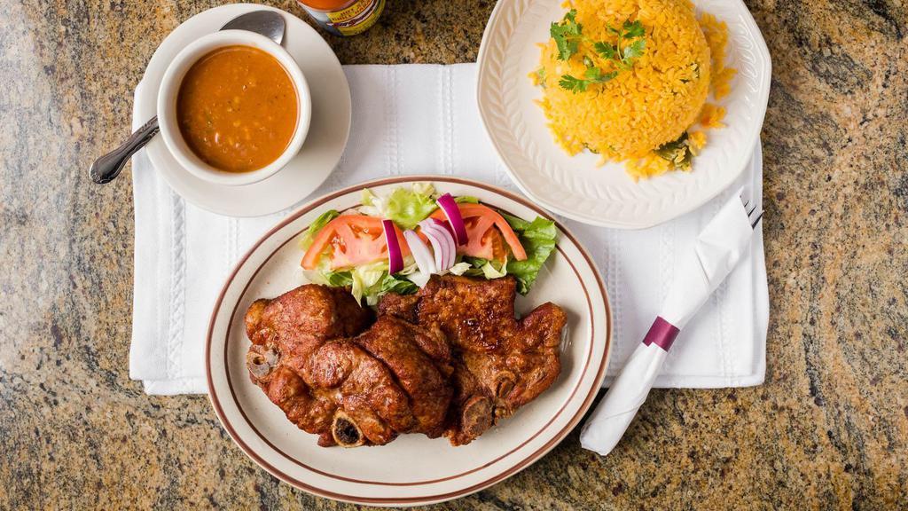Fried Pork Chops · Served with rice and beans, sweet, green plantains, French fries, or vegetables.