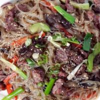 Stir-Fried Noodles With Bulgogi 불고기잡채 · Korean glass noodle stir fried with marinated beef and vegetables