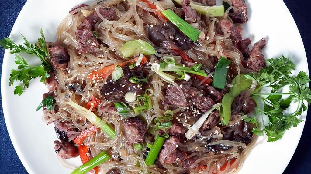 Stir-Fried Noodles With Bulgogi 불고기잡채 · Korean glass noodle stir fried with marinated beef and vegetables