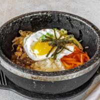 Dolsot Bi Bim Bap 돌솥 비빔밥 · Rice topped with vegetables, and egg