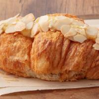 Almond Croissant · Flaky and Buttery and Topped with Toasted Almonds. A twist on a Classic French Pastry!