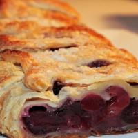 Cherry Strudel · Crisp pastry envelops a sweet and tart cherry filling for a delectable, finger-licking desse...