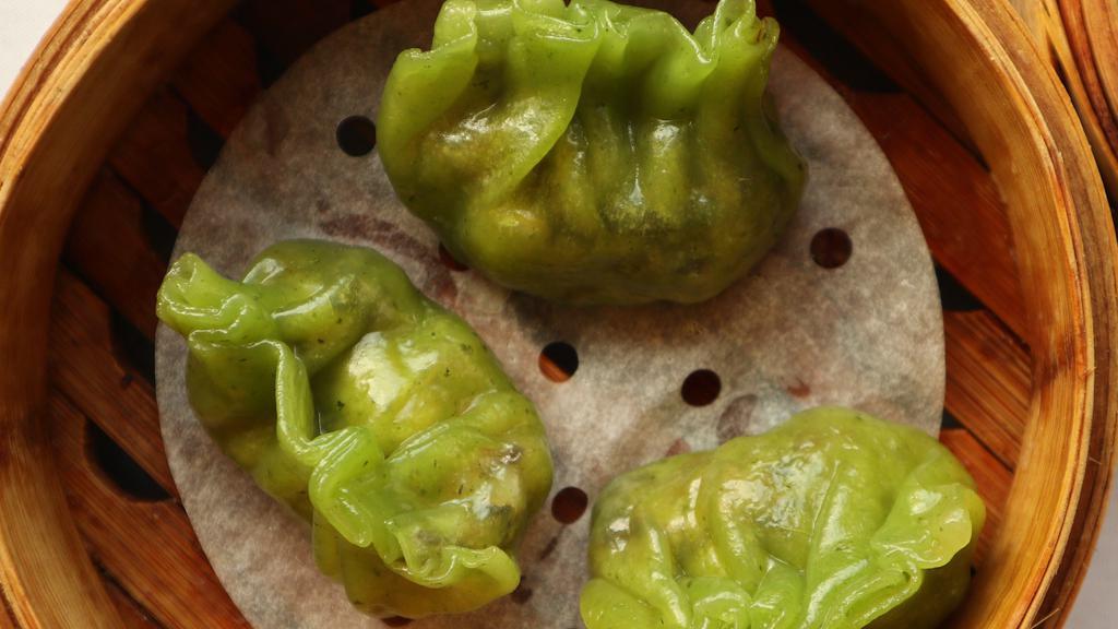 Spinach Dumplings 菠菜餃 (3Pcs) (Vegan) · Vegetarian. Handmade signature dumplings filled with edamame, wood ear mushroom, and carrots wrapped in housemade crystal skin wrappers naturally-dyed with spinach juice