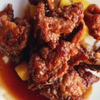 Peking Pork Chops 京都骨 · Sweet and sour fried pork chops. Served with housemade pickles and white rice
