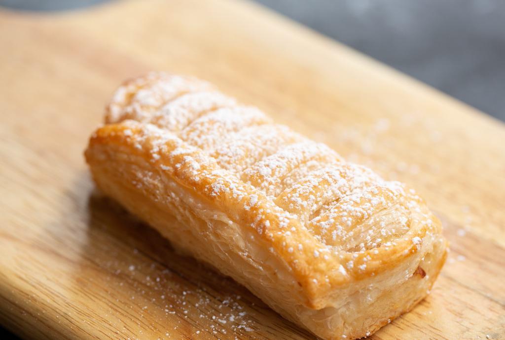 Apple Turnover · Flaky pup pastry dough, filled with green apples.