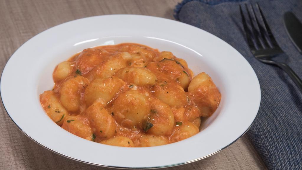 Gnocchi Alla Sorrentina · Homemade potato dumpling, mozzarella and parmesan cheese, tomato sauce and fresh basil.