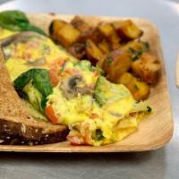 Veggie Omelette · Omelet with spinach, tomatoes, broccoli, mushrooms, and onions.