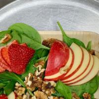 Tri-Colored Spinach Salad · Vegan. Salad with spinach, apples, strawberries, walnuts, and a balsamic vinegar dressing.