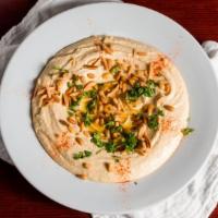 Hummus Delight · Sauteed almonds and pine nuts over hummus. (our spicy dressing optional ).