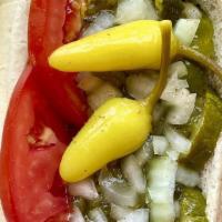 Chicago Dog · A Chicago tradition our way. Topped with yellow mustard, onions, green relish, tomatoes, kos...