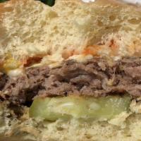 Classic American Burger · Just like it was in the 1950's. Topped with yellow mustard, ketchup, chopped onions, and pic...