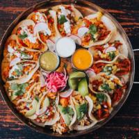 Tacos Package · INCLUDES: House made Chips and Salsa + 8 Tacos + 2 Pork Carnitas Tacos (corn tortilla, brais...