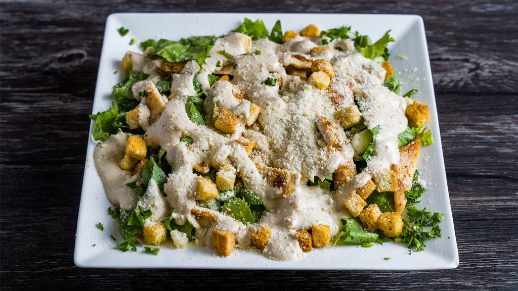 Caesar Salad · Lettuce, croutons, parmesan cheese grated or shaved and caesar dressing on top.