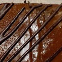 Chocolate Brownie Cake · Imported Moist Chocolate Cake with Fudge topping.
