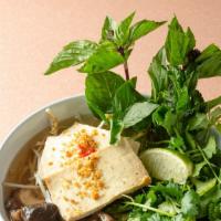 Lemongrass & Ginger Tofu Pho Soup · Clear broth with vermicelli rice noodle, bean sprouts, shiitake mushroom, basil, cilantro, m...