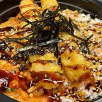 Crunch Bowl · Shrimp tempura, fresh spicy tuna, crab salad, unagi sauce, bubu arare, and garlic chips.