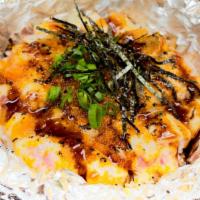 Garlic Seared Salmon · Fresh salmon diced mixed with garlic aioli and tobiko, torched topped with garlic onion sauc...