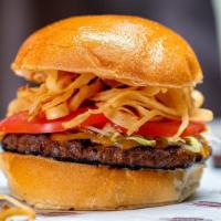 Chipotle Bison Burger · Natural raised buffalo meat marinated in chipotle seasoning topped with crispy onion straws,...
