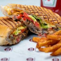 Veggie Panini · Tomatoes, lettuce, mushrooms, red peppers, red onions, chipotle mayo, and pepper jack cheese.