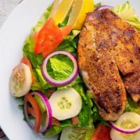 Grilled Tilapia Salad · Fresh filet served grilled over romaine lettuce, tomatoes, diced onions, and cucumbers.