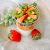 Vanilla Yogurt · Vanilla yogurt with Granola, fresh Blueberries and Strawberries,.