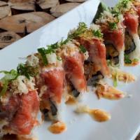 Volcano Roll · Shrimp tempura top with spicy tuna, sweet chili sauce, fried onions, crunchy and scallion.