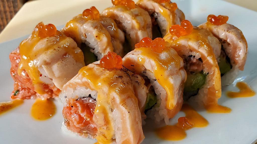 Crazy Salmon Roll · Spicy salmon and avocado top with seared salmon, spicy mayo and salmon roe.