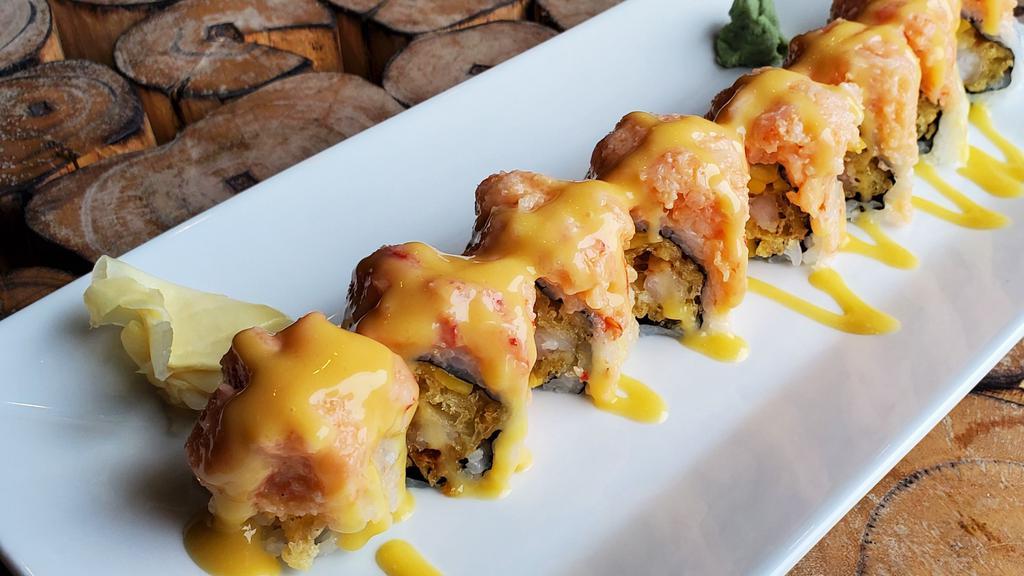 Wonder Roll · Shrimp tempura and mango top with lobster salad and mango sauce.