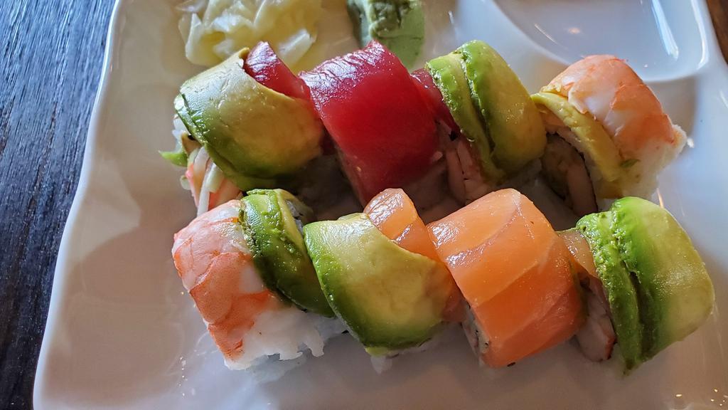 Rainbow Roll · Crab stick, cucumber and avocado top with salmon, tuna, shrimp and avocado.