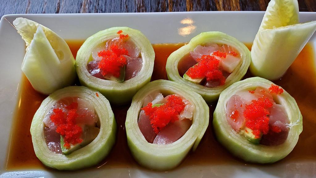 Twister Roll · Cucumber wrapped salmon, tuna, white tuna, yellowtail, avocado top with caviar and ponzu sauce.